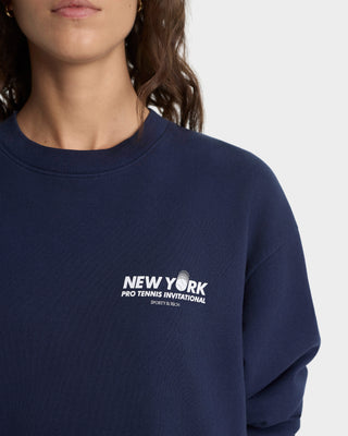 Navy blue sweatshirt with 'New York Pro Tennis Invitational' logo on a plain background