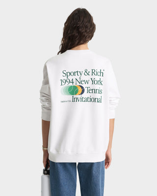 Person wearing a white sweatshirt with 'Sporty & Rich' text and logo on the back, standing against a white background.