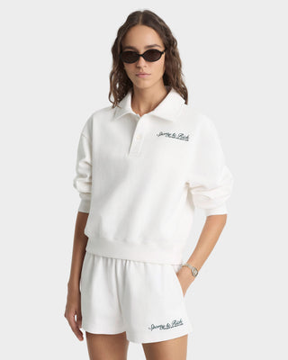 Woman wearing a white outfit with 'game plan' branding on a white background