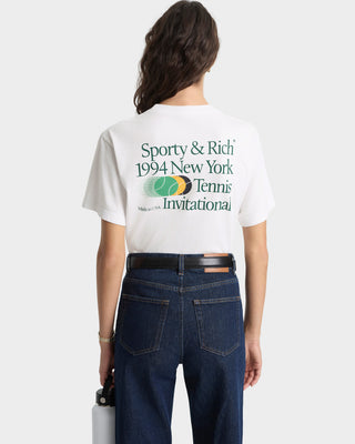 Person wearing a white t-shirt with 'Sporty & Rich' text and graphics, standing against a plain background.