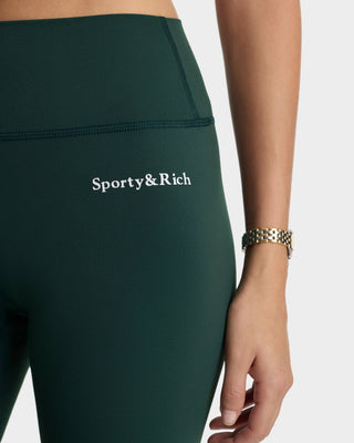 Green leggings with 'Sporty&Rich' logo on a white background