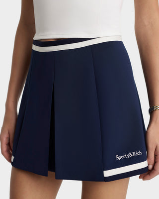 Navy skirt with white trim and 'Sporty&Rich' logo on a white background