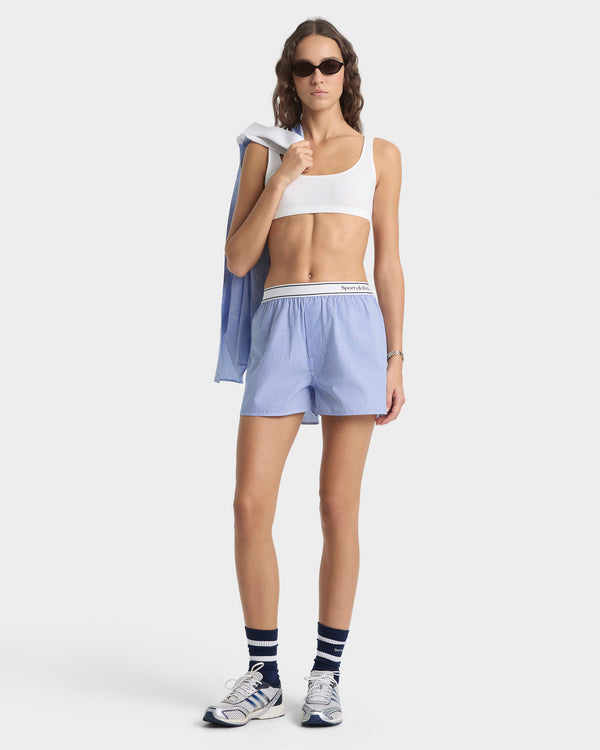 Woman in athletic wear with a white background