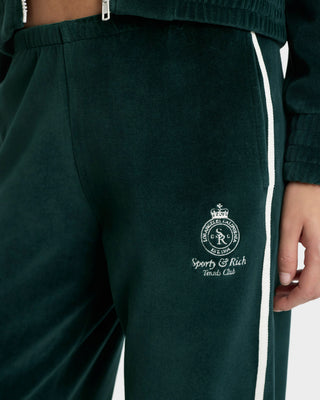 Green tracksuit with a logo and text on a white background
