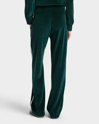 Green tracksuit with white stripes on a light gray background