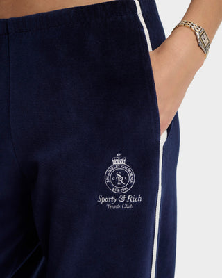 Navy blue pants with a logo and text on a white background