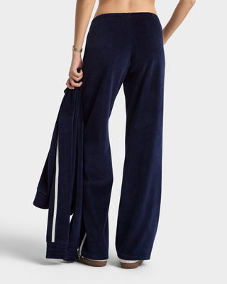 Navy blue wide-leg pants worn by a person on a white background