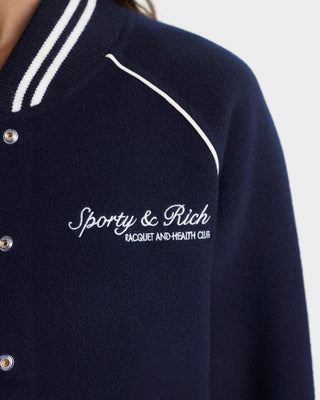 Navy cardigan with white trim and 'Sporty & Rich' logo on a light gray background