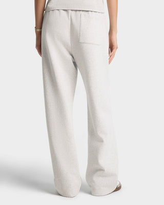 Light gray pants worn by a person on a white background