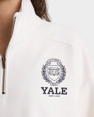 White hoodie with Yale logo on a blurred background