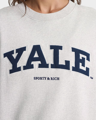 Gray sweatshirt with 'YALE' printed in navy and 'SPORTY & RICH' in black.