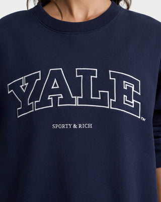 Navy blue sweatshirt with 'YALE' and 'Sporty & Rich' text on a plain background