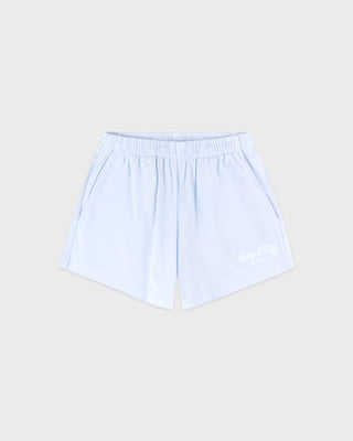 Light blue shorts on a beige background