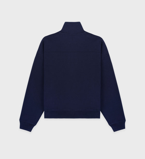 The JFK Quarter Zip - Navy/White is a navy blue long-sleeve sweatshirt with a high collar, made from 100% cotton and shown from the back on a white background.