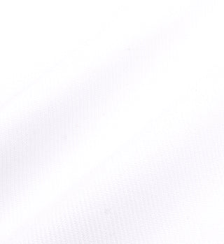 Close-up of the high quality fabric with diagonal ridges and subtle shadows used in the Golf Logo Kelly Skirt - White/Bright Red, commonly featured in garments with an elastic waist.