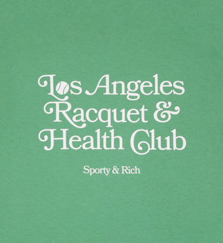 The LA Racquet Club T-Shirt - Verde/White features white Los Angeles Racquet & Health Club. Sporty & Rich text with a tennis ball as the o on green 100% USA-grown cotton. Made in the USA for quality and comfort.