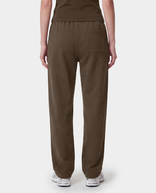 Brown pants worn by a person on a white background