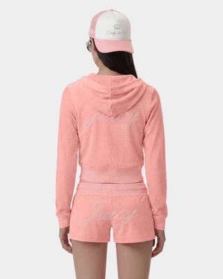 Person wearing a pink hoodie and shorts set with 'Live' text, standing against a white background