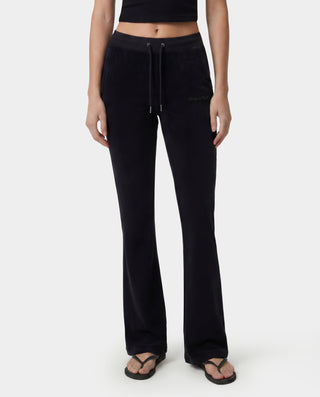 Black pants worn by a person on a white background