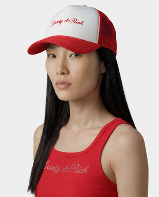 Woman wearing a red and white cap and tank top with 'Poorly & Rich' text on a white background