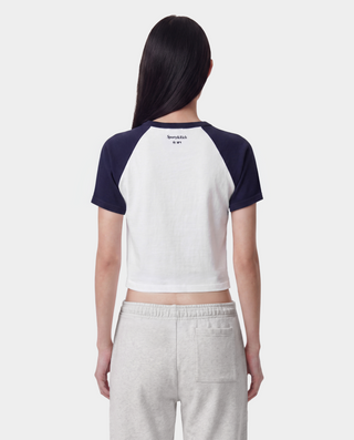 Dodgers Serif Baby Baseball Tee in White, Dark Navy, and Fire Red—crafted from 100% cotton, this stylish cropped raglan shirt features bold Dodgers text and a red LA logo on the front.