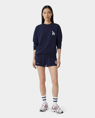 Introducing the LA Serif Crewneck in Dark Navy/White, a 100% cotton crewneck sweatshirt featuring a white LA logo on the upper left chest.
