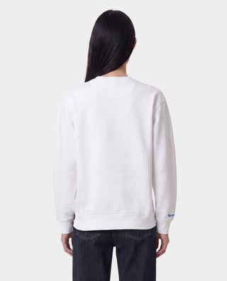 LA Serif Crewneck - White/Team Blue features an oversized fit and is made from 100% cotton, showcasing a blue LA logo on the upper left chest. Displayed on a plain light gray background.