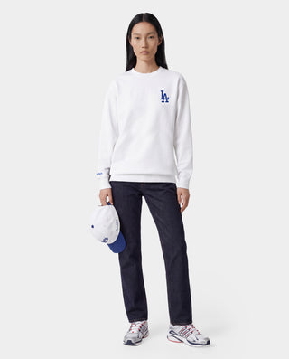 LA Serif Crewneck - White/Team Blue features an oversized fit and is made from 100% cotton, showcasing a blue LA logo on the upper left chest. Displayed on a plain light gray background.