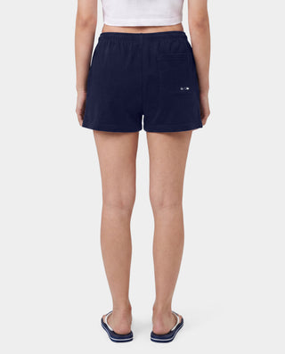 The LA Serif Disco Short in Dark Navy/White is a pair of super-short, cotton fleece shorts featuring Sports&Rich and LA logos on the front, made in the USA and displayed laid flat on a white background.