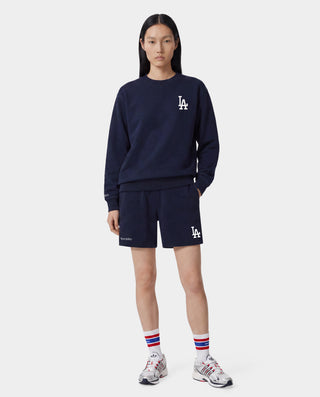 Dodgers Serif Gym Short in Dark Navy/White, featuring LA and Sporty & Rich logos on the front, an elastic waistband, crafted from 100% cotton in Portugal. Presented against a white background.