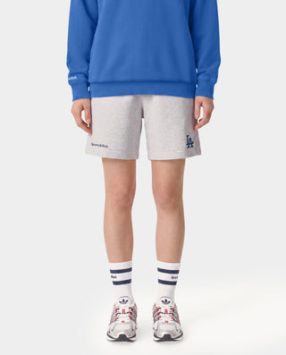 Dodgers Serif Gym Short in Heather Gray/Navy features an elastic waistband, side pockets, and navy Sporty & Rich and LA logos on the legs. Made in Portugal from 100% cotton for comfort and style.