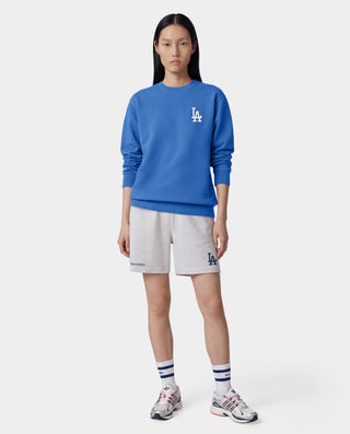 Dodgers Serif Gym Short in Heather Gray/Navy features an elastic waistband, side pockets, and navy Sporty & Rich and LA logos on the legs. Made in Portugal from 100% cotton for comfort and style.