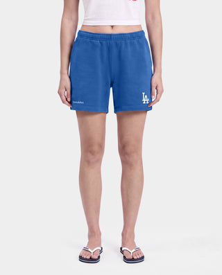 Dodgers Serif Gym Shorts in Team Blue/White, made in Portugal from 100% cotton, featuring white Sporty & Rich and LA logos printed on the left leg.