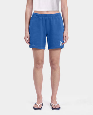 Dodgers Serif Gym Shorts in Team Blue/White, made in Portugal from 100% cotton, featuring white Sporty & Rich and LA logos printed on the left leg.
