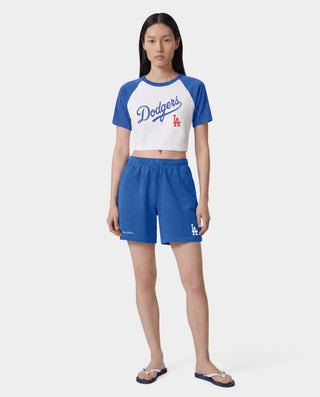 Dodgers Serif Gym Shorts in Team Blue/White, made in Portugal from 100% cotton, featuring white Sporty & Rich and LA logos printed on the left leg.