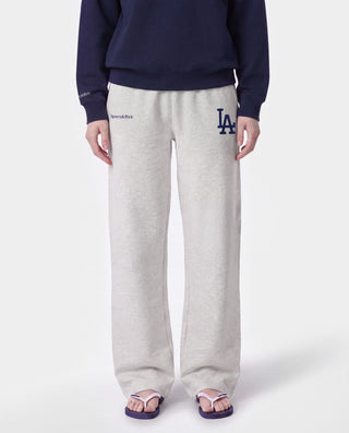 Introducing the LA Serif Wide Sweatpant in Heather Gray/Navy, featuring a wide leg silhouette with navy Sports & Rich and a large LA logo printed on the front. Made from 100% cotton, these sweatpants offer an elastic waistband for ultimate comfort.