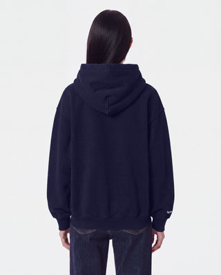The LA Serif Zip Hoodie in Dark Navy/Navy features a zip front, LA logo on the left chest, and front pockets. Made from 100% cotton for comfort, this oversized hoodie is shown on a white background.