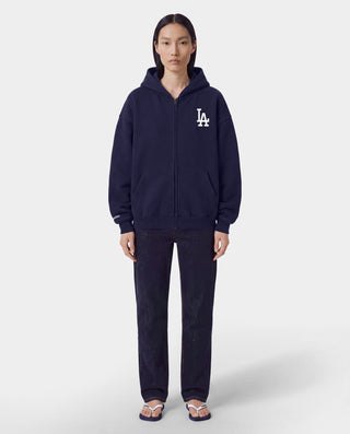 The LA Serif Zip Hoodie in Dark Navy/Navy features a zip front, LA logo on the left chest, and front pockets. Made from 100% cotton for comfort, this oversized hoodie is shown on a white background.