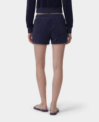 HWCNY Disco Short in Dark Navy/White is made from athletic cotton fleece, features an elastic waistband, and has the Sporty & Rich logo printed in white on the lower left leg. Made in the USA.