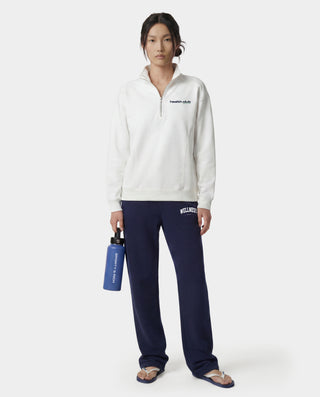 Wellness Ivy Wide Sweatpant in Dark Navy/White, featuring "WELLNESS" text on the left pocket, made from 100% cotton with an elastic waistband, displayed flat on a white background.