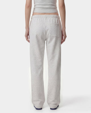 Wellness Ivy Wide Sweatpant in Heather Gray/Light Navy, featuring "WELLNESS" text on the left pocket and crafted from 100% cotton with an elastic waistband, displayed on a plain white background.