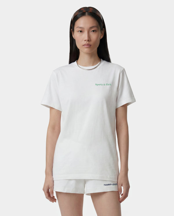 Fitness 94 T-Shirt - White/Kelly, made in the USA from 100% cotton. Features a white base with "Sporty & Rich" text in green on the upper left chest, displayed on a plain background.