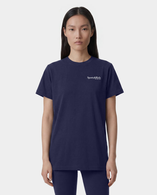 HWCNY T-Shirt in Dark Navy/White, featuring a white Sporty & Rich logo on the left chest, crafted from 100% cotton and made in the USA, displayed on a white background.