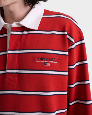 Red striped polo shirt with Sporty & Rich logo on a white background