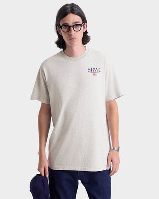 Person wearing a light gray t-shirt with 'SRWC' logo on a white background