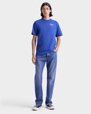 Person wearing a blue t-shirt and jeans on a white background