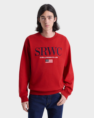 Person wearing a red sweatshirt with 'SRWC Wellness Club' text on a white background