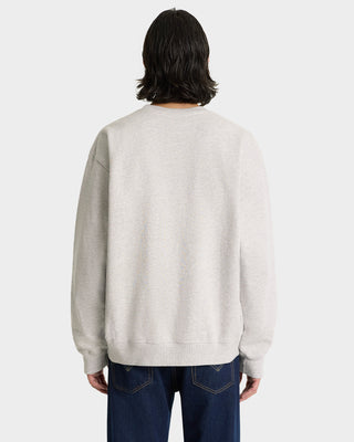 Person wears the Syracuse Embroidered Crewneck in Heather Gray/Navy with dark jeans, shown from the back against a plain background.