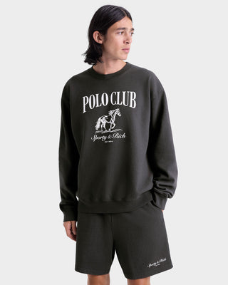 Person wearing a black 'Polo Club' sweatshirt with a horse logo on a white background