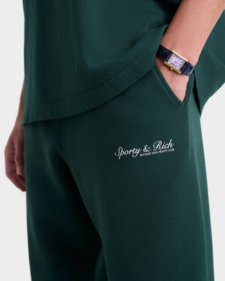 Green outfit with 'Sporty & Rich' logo on a white background